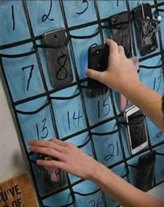 Students storing computers prior to class