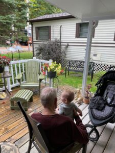 "Papa Doug" with his great grandson, Boaz watching the birds at the feeders in the rain.